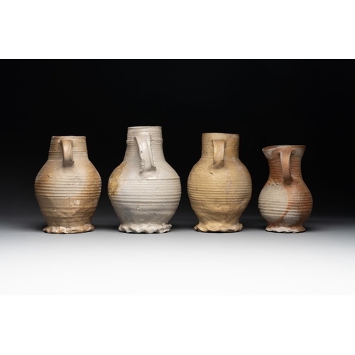 1169 - A collection of 8 German proto stoneware ribbed jugs, including 'Jacobakans', 14th C.H.: 24 cm (the ... 