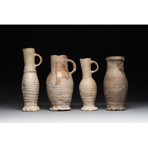 1169 - A collection of 8 German proto stoneware ribbed jugs, including 'Jacobakans', 14th C.H.: 24 cm (the ... 