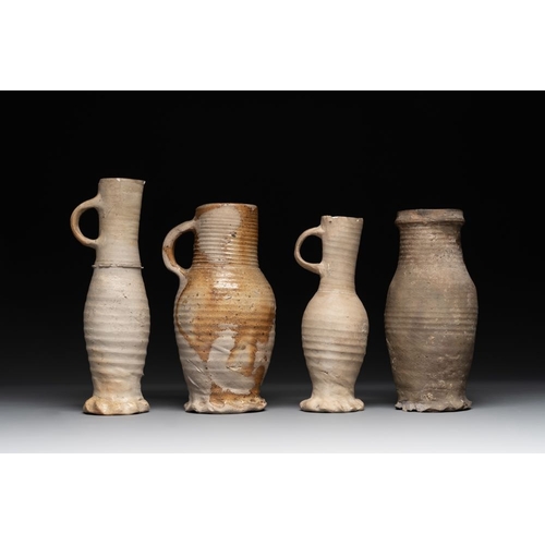 1169 - A collection of 8 German proto stoneware ribbed jugs, including 'Jacobakans', 14th C.H.: 24 cm (the ... 