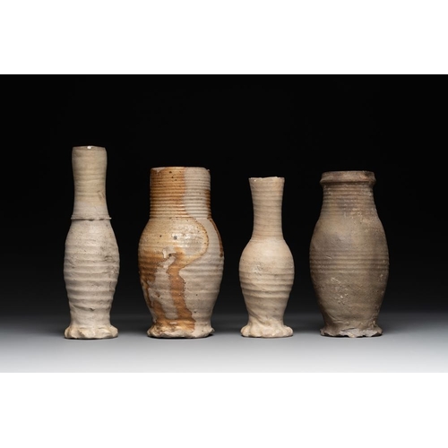 1169 - A collection of 8 German proto stoneware ribbed jugs, including 'Jacobakans', 14th C.H.: 24 cm (the ... 