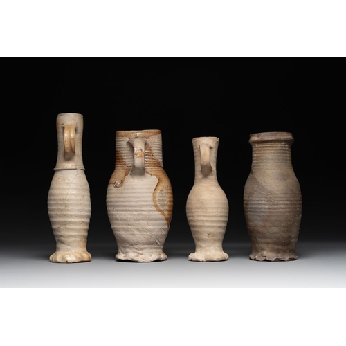 1169 - A collection of 8 German proto stoneware ribbed jugs, including 'Jacobakans', 14th C.H.: 24 cm (the ... 