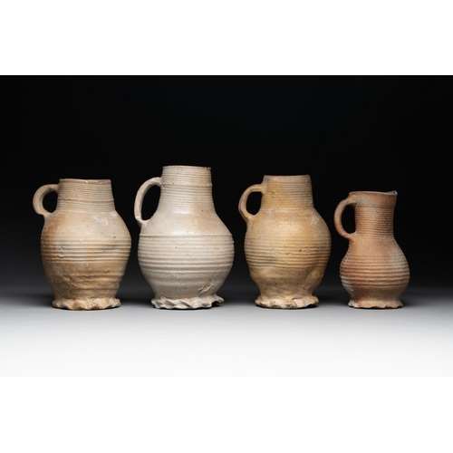 1169 - A collection of 8 German proto stoneware ribbed jugs, including 'Jacobakans', 14th C.H.: 24 cm (the ... 