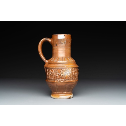 1180 - A Raeren stoneware 'peasant dance' jug, late 16th C.H.: 22,5 cm