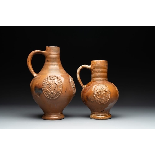 1182 - Two armorial stoneware jugs, Raeren, 16/17th C.H.: 30 cm (the tallest)H.: 24 cm (the smallest)
... 