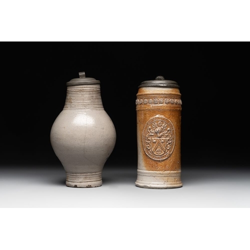 1183 - Two stoneware jugs with pewter lids, one with a coat of arms and dated 1636, Germany, 17th C.H.: 24 ... 