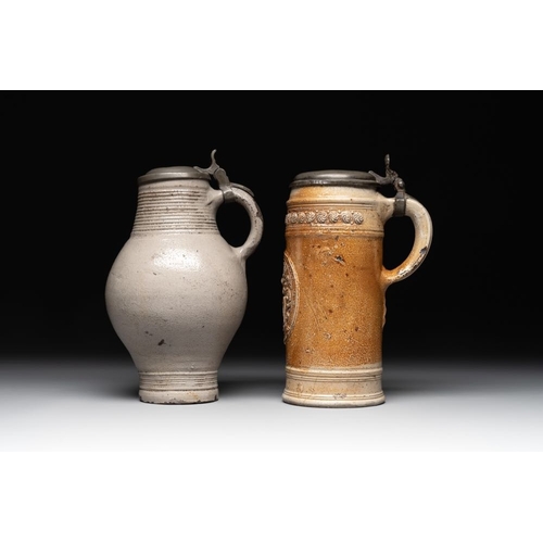 1183 - Two stoneware jugs with pewter lids, one with a coat of arms and dated 1636, Germany, 17th C.H.: 24 ... 