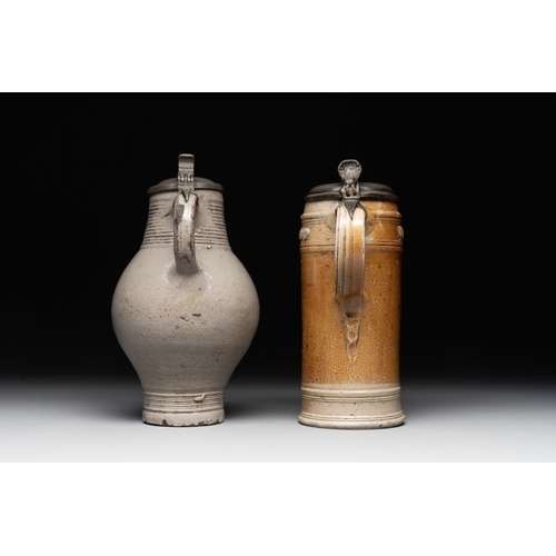 1183 - Two stoneware jugs with pewter lids, one with a coat of arms and dated 1636, Germany, 17th C.H.: 24 ... 