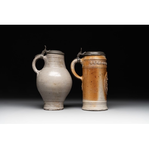 1183 - Two stoneware jugs with pewter lids, one with a coat of arms and dated 1636, Germany, 17th C.H.: 24 ... 