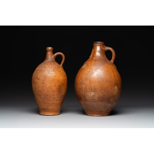 1184 - Three German stoneware jugs, including a bellarmine, and a French or English pottery jug, 17th C. an... 