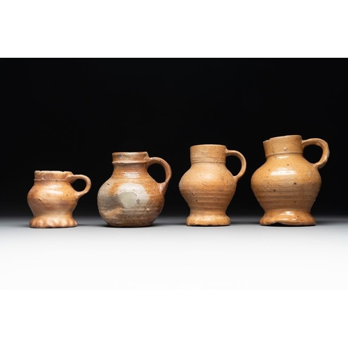 1186 - A collection of 13 German stoneware jugs, 15th C. and laterH.: 19,5 cm (the largest)H.: 9,5 cm (the ... 