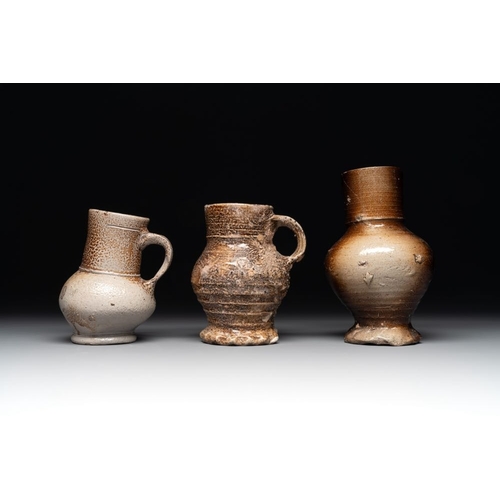 1186 - A collection of 13 German stoneware jugs, 15th C. and laterH.: 19,5 cm (the largest)H.: 9,5 cm (the ... 