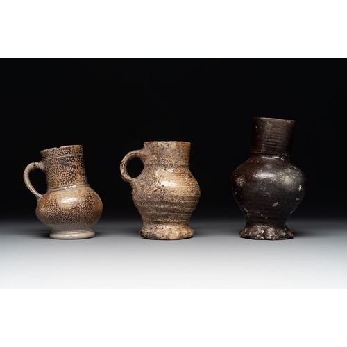 1186 - A collection of 13 German stoneware jugs, 15th C. and laterH.: 19,5 cm (the largest)H.: 9,5 cm (the ... 