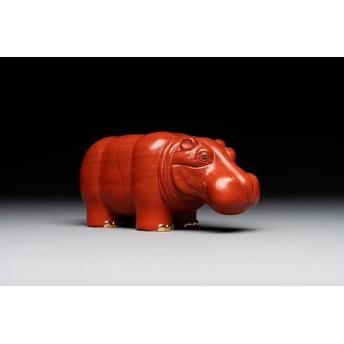 1191 - An 18kt gold mounted red jasper hippopotamus with sapphire inset eyes in Faberge-style, early 20th C... 