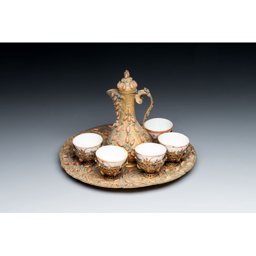 1197 - An Ottoman coral-and-turquoise-inlaid gilt-copper tea service with five Chinese wucai cups, 19th C.L... 