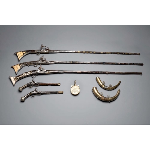 1200 - Three impressive flintlock muskets or 'moukahlas', two percussion pistols and three gunpowder horns,... 