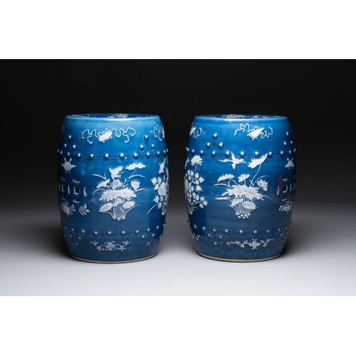 146 - A pair of Chinese white slip-decorated blue-ground garden seats, 19th C.Dia.: 34 cm - H.: 54 cm (eac... 