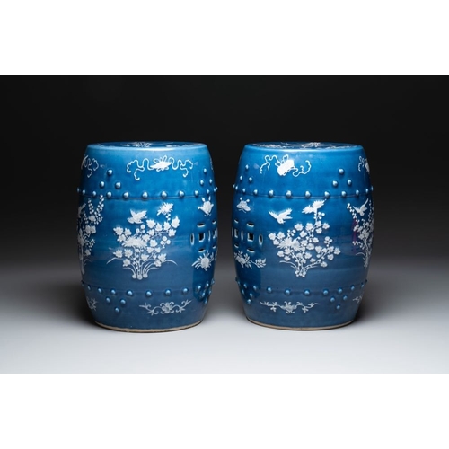 146 - A pair of Chinese white slip-decorated blue-ground garden seats, 19th C.Dia.: 34 cm - H.: 54 cm (eac... 