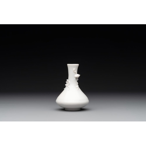 164 - A small Chinese Dehua blanc de Chine 'dragon' bottle vase, KangxiH.: 10 cm