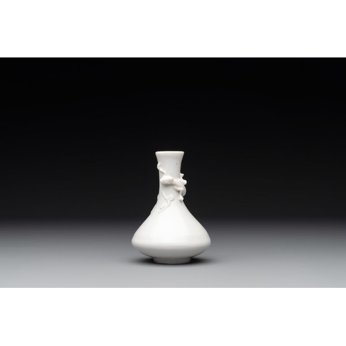 164 - A small Chinese Dehua blanc de Chine 'dragon' bottle vase, KangxiH.: 10 cm