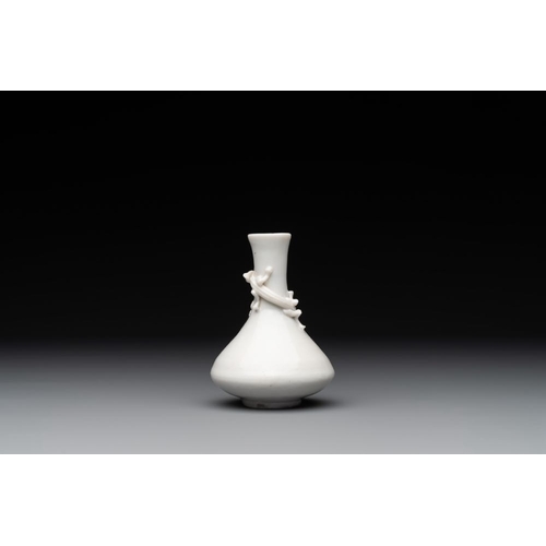 164 - A small Chinese Dehua blanc de Chine 'dragon' bottle vase, KangxiH.: 10 cm