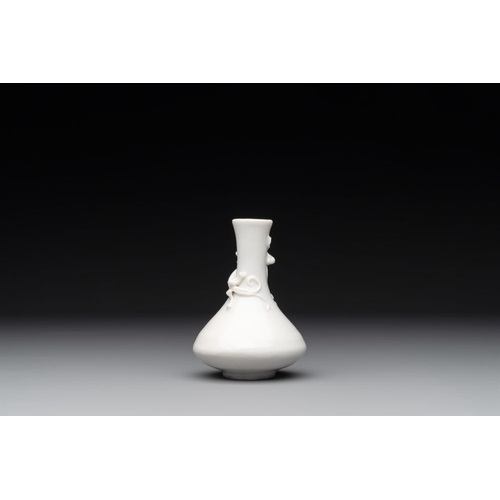 164 - A small Chinese Dehua blanc de Chine 'dragon' bottle vase, KangxiH.: 10 cm