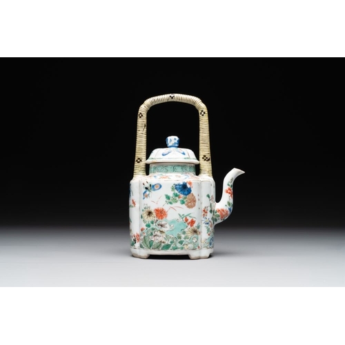 18 - A Chinese famille verte 'flower and butterfly' teapot with an upright handle, KangxiL.: 12 cm - H.: ... 