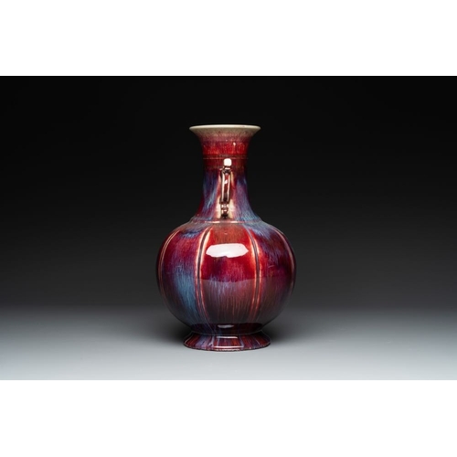 188 - A Chinese flambe-glazed vase with archaistic dragon handles, 19th C.H.: 34,5 cm