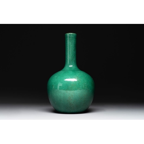 202 - A Chinese apple-green-glazed and two copper-red-glazed bottle vases, Kangxi mark, 19/20th C.H.: 33,3... 