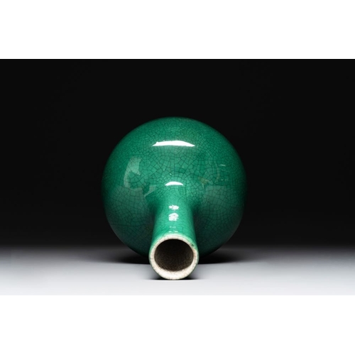 202 - A Chinese apple-green-glazed and two copper-red-glazed bottle vases, Kangxi mark, 19/20th C.H.: 33,3... 