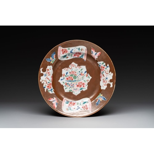 218 - A Chinese famille rose dish, a teapot, a milk jug and a cup, Yongzheng/QianlongDia.: 22,4 cm (the di... 