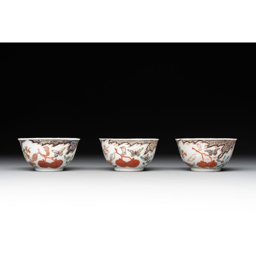 231 - Three Chinese famille rose 'flowers and butterflies' cups and saucers, YongzhengDia.: 11,7 cm (the s... 