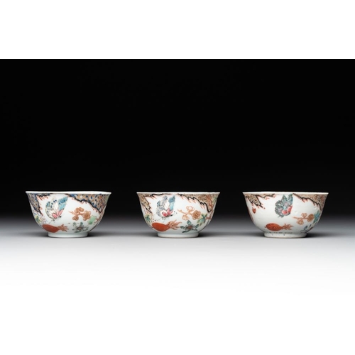 231 - Three Chinese famille rose 'flowers and butterflies' cups and saucers, YongzhengDia.: 11,7 cm (the s... 