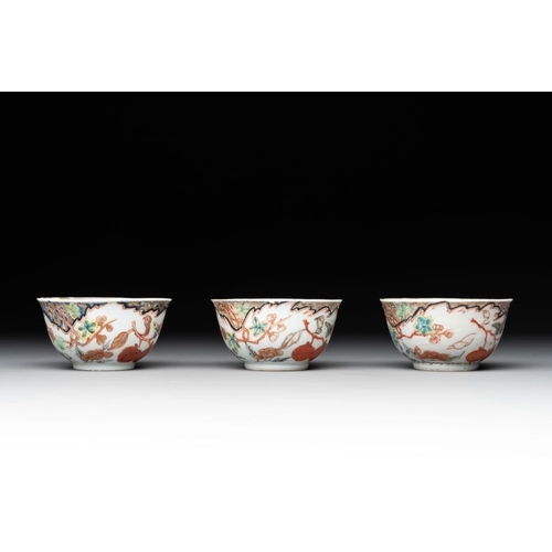 231 - Three Chinese famille rose 'flowers and butterflies' cups and saucers, YongzhengDia.: 11,7 cm (the s... 