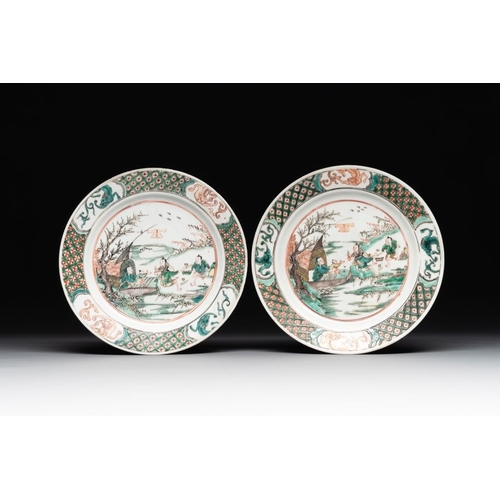 24 - A pair of Chinese famille verte plates with figures along the riverside, artemisia leaf and ding mar... 