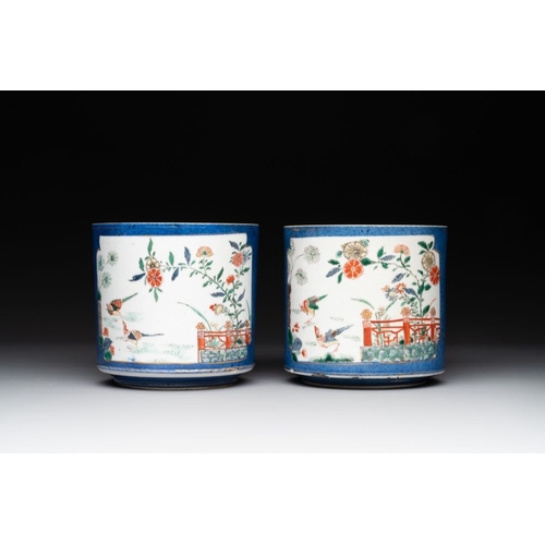 25 - A pair of Chinese powder blue-ground famille verte vessels with a bird in a garden, KangxiH.: 12 cm... 