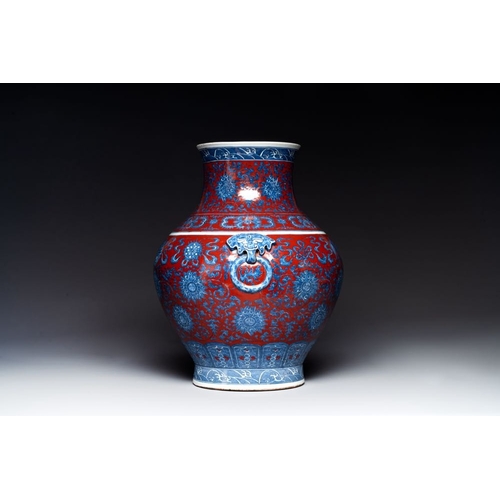 276 - A Chinese blue, white and iron-red 'bajixiang' 'hu' vase on wooden stand, Qianlong mark, 19th C.H.: ... 