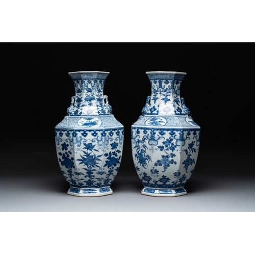 278 - A pair of Chinese blue and white octagonal vases with floral design, 19th C.H.: 49 cm... 