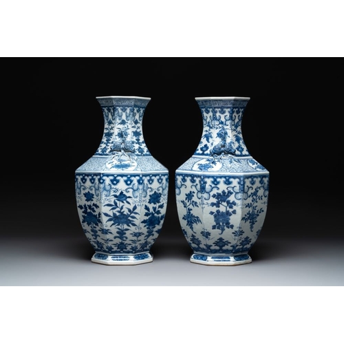 278 - A pair of Chinese blue and white octagonal vases with floral design, 19th C.H.: 49 cm... 