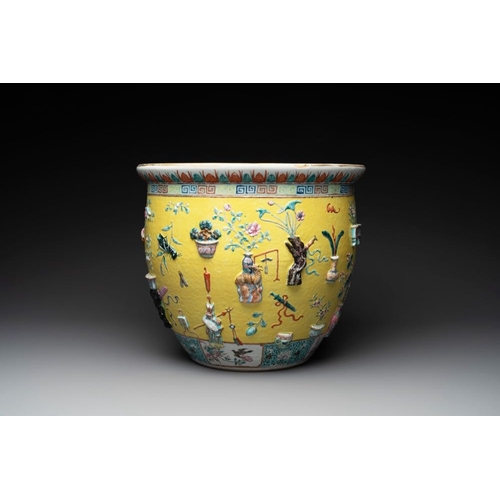 290 - A Chinese famille rose yellow-ground relief-molded 'antiquities' fish bowl, 19th C.Dia.: 40 cm - H.:... 