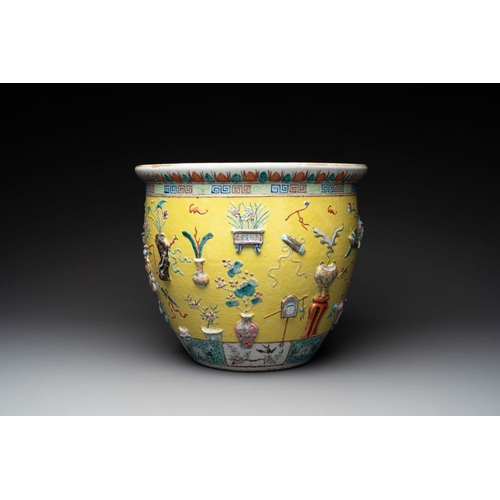 290 - A Chinese famille rose yellow-ground relief-molded 'antiquities' fish bowl, 19th C.Dia.: 40 cm - H.:... 