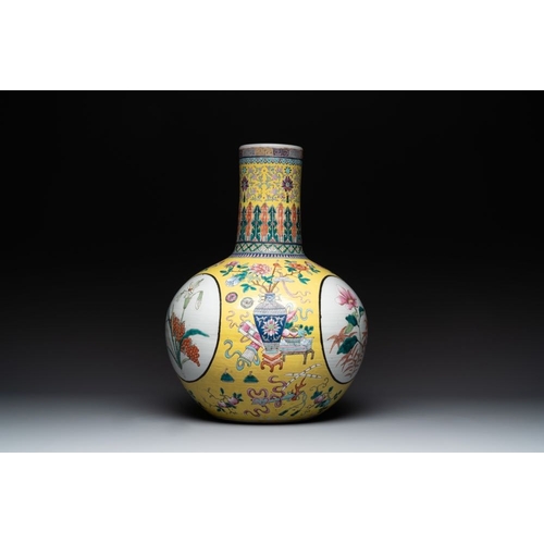 291 - A large Chinese famille rose yellow-ground 'tianqiu ping' vase with flowers and antiquities, 19th C.... 