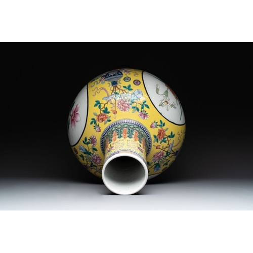 291 - A large Chinese famille rose yellow-ground 'tianqiu ping' vase with flowers and antiquities, 19th C.... 