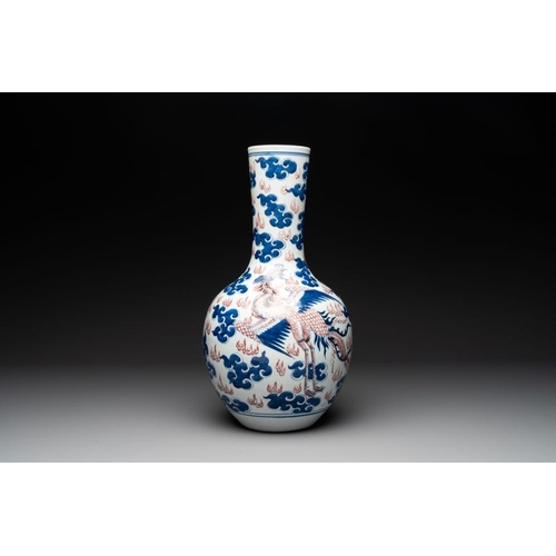 296 - A Chinese blue, white and copper-red 'dragon and phoenix' vase, 19th C.H.: 47,5 cm... 