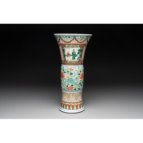 297 - A Chinese wucai 'gu' vase with Buddhist lions, peony scrolls and figures, 19th C.H.: 43 cm... 