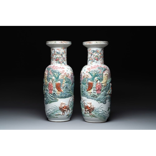 306 - A pair of Chinese famille rose '18 luohan' vases with relief design, 19th C.H.: 60 cm... 