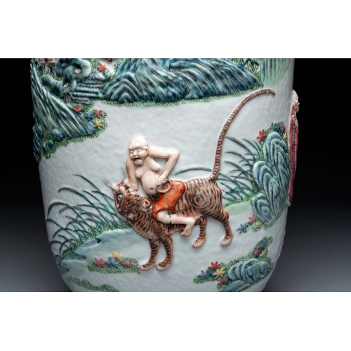 306 - A pair of Chinese famille rose '18 luohan' vases with relief design, 19th C.H.: 60 cm... 