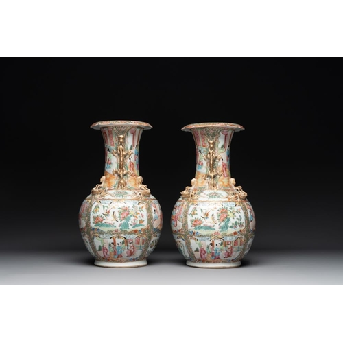 311 - A pair of Chinese Canton famille rose vases with narrative design, 19th C.H.: 36 cm... 