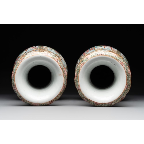 311 - A pair of Chinese Canton famille rose vases with narrative design, 19th C.H.: 36 cm... 