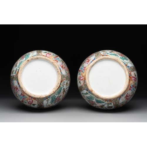 311 - A pair of Chinese Canton famille rose vases with narrative design, 19th C.H.: 36 cm... 