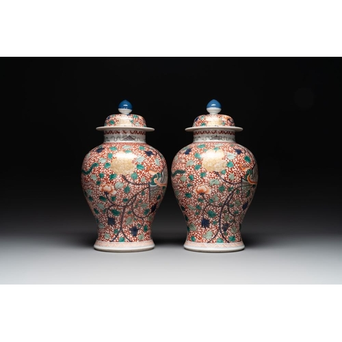 312 - A pair of Chinese famille verte 'phoenix' vases and covers, 19th C.H.: 44,5 cm (incl. cover)H.: 35 c... 